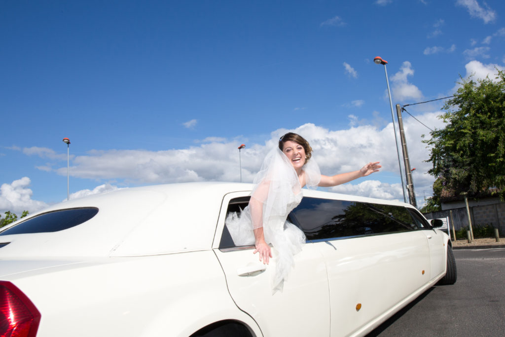 Luxury Limo Limousine With A Bride Under Blue Sky
